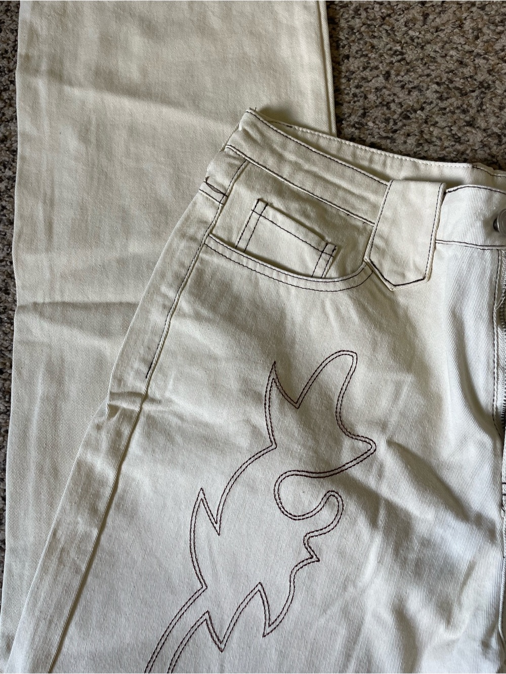 Cream High-Waist Jeans with Embroidered Design